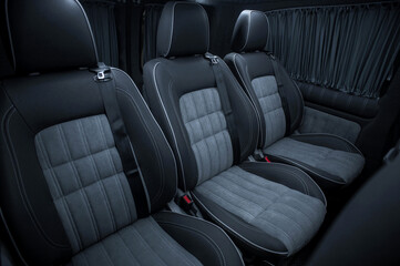 Comfortable interior of a passenger bus with soft seats