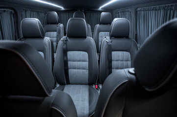 Obraz premium Comfortable interior of a passenger bus with soft seats