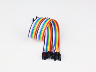 This image shows jumper wires. These wires are often grouped into cables with connectors or pins at...
