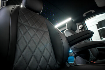 Comfortable interior of a passenger bus with soft seats