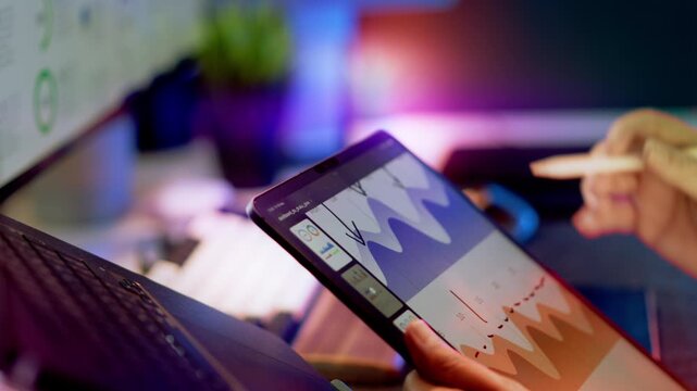 Tablet Chart Drawing Data Analysis Business Notes showing male hand using stylus creating annotations digital graph modern workspace data visualization productivity strategy concept