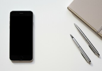 Smartphone Notebook Pen Flat Lay