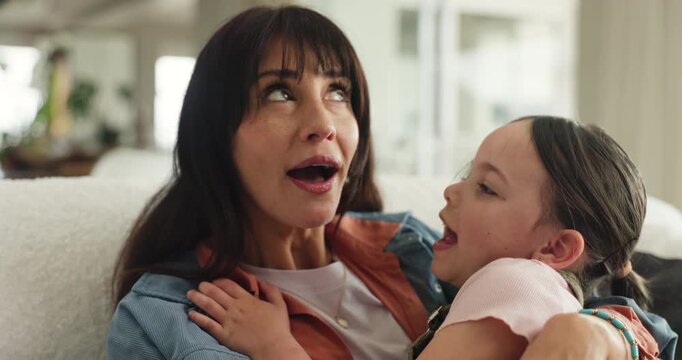 Bonding, mom and child in home, kiss and embrace on couch, smile and affection on weekend in lounge. Woman, love and hug daughter in living room, single parent and happy with kid on break in house