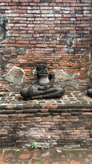 Wat Chaiwatthanaram in Ayutthaya, Thailand. Scenic ruins of the Buddhist temple in the ancient city. Parts of Buddha statues.