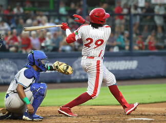 baseball player #29 hitting