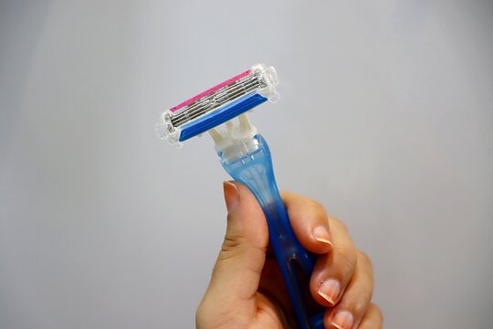 Woman Holding Razor. Shaving stick. 
