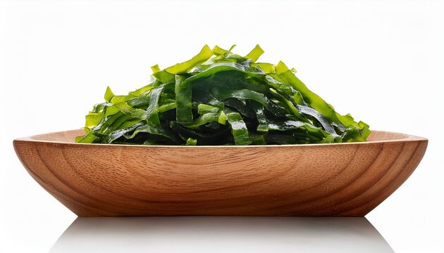closeup heap of green laver ulva lactuca or sea lettuce seaweed cutout in wood bowl