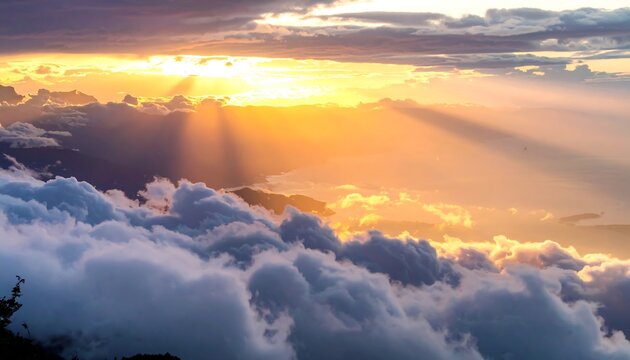 Majestic sunset over mountaintops and clouds