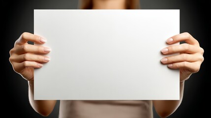 Obraz premium Woman holds blank paper focus on woman and empty paper woman holds blank paper - focus on woman and empty paper