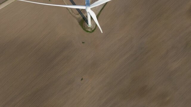 Top-Down Aerial View of Wind Turbine Generating Renewable Energy on Farmland