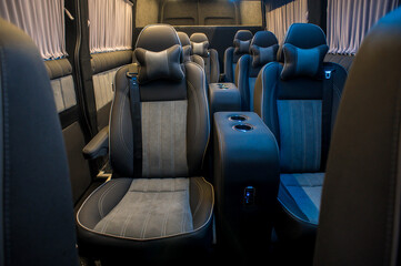 Fototapeta premium Comfortable interior of a passenger bus with soft seats