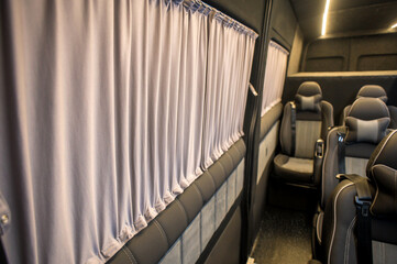 Comfortable interior of a passenger bus with soft seats