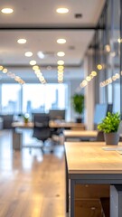Fototapeta premium Blurred background of a modern office interior with bokeh lights and open workspace