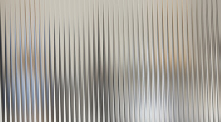 Obraz premium Abstract background with vertical ribbed texture and blurred gray and blue elements