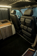 Comfortable interior of a passenger bus with soft seats