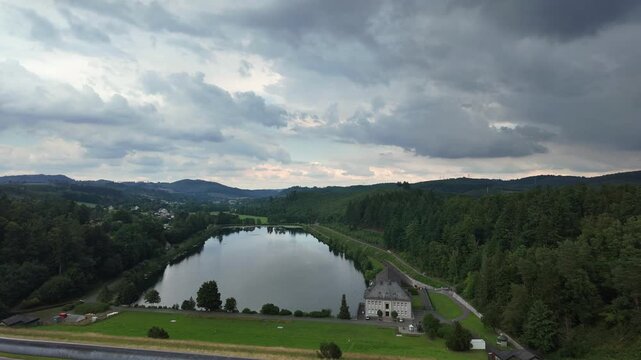 Sauerland from above: Timelapse of the village of Sunden and the Sorpe Dam with moving clouds