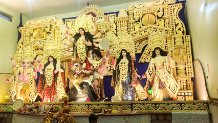a pandal, an elaborately decorated temporary structure, during the Hindu festival of Durga Puja. This festival is a celebration of the goddess Durga's victory over the demon Mahishasura,