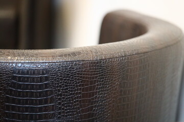 A close-up shot of a luxurious leather armchair with intricate details