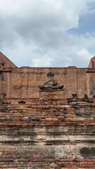 Wat Chaiwatthanaram in Ayutthaya, Thailand. Scenic ruins of the Buddhist temple in the ancient city. Parts of Buddha statues.
