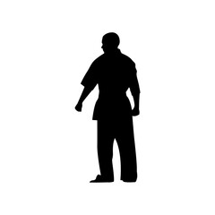 This silhouette depicts a karate practitioner in a traditional uniform, showcasing the discipline and focus inherent in this martial art. The figure stands still, ready for action.
