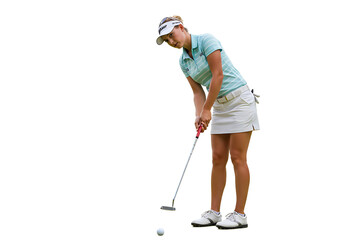Female golfer putting on green grass with focus and concentration  