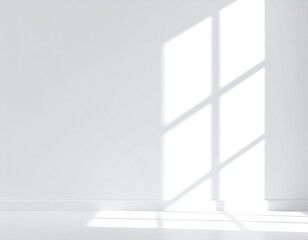 Sunlight casts shadows on a white room
