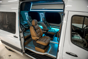 Comfortable interior of a passenger bus with soft seats