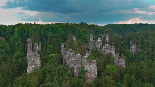 Aerial footage showcasing the natural beauty of Hrub&aacute; Sk&aacute;la Rock City within the Bohemian Paradise Česk&yacute; r&aacute;j protected landscape area in the Czech Republic. Featuring impressive sandstone rock formati