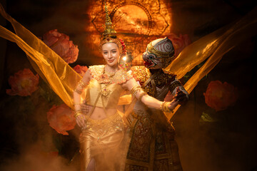 Traditional Thai dance performance featuring a graceful female dancer and a masked Khon performer