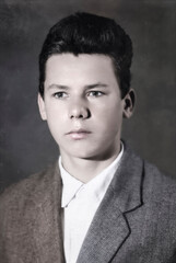 A vintage portrait of a handsome young man with a serious face. Retro photo from the 1960s.