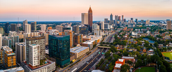 Atlanta city skyline at sunset with highways and modern downtown buildings