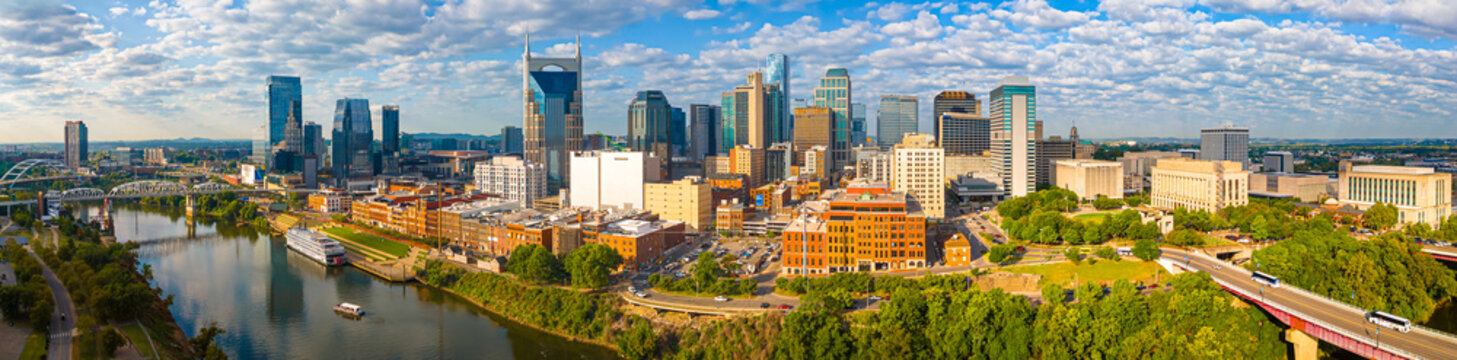 Nashville skyline at sunrise with river and modern skyscrapers