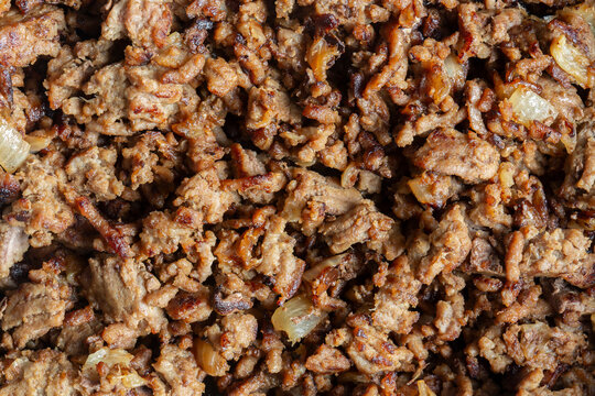 Fried lean beef steak mince with onions fried background backdrop.