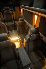 Comfortable interior of a passenger bus with soft seats