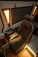 Comfortable interior of a passenger bus with soft seats