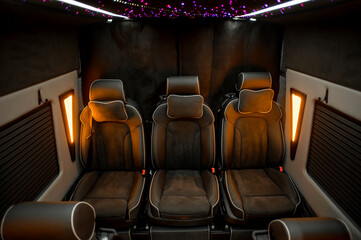 Comfortable interior of a passenger bus with soft seats