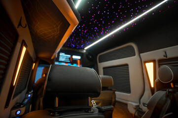 Comfortable interior of a passenger bus with soft seats