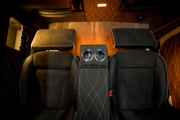 Comfortable interior of a passenger bus with soft seats