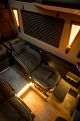 Comfortable interior of a passenger bus with soft seats