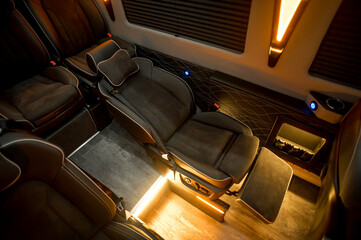 Comfortable interior of a passenger bus with soft seats