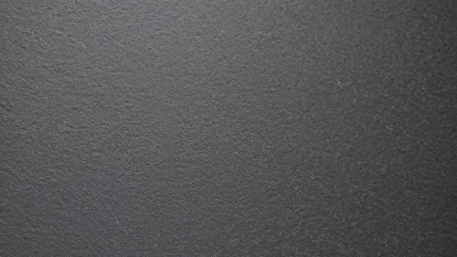 Close-up view of a textured surface captures intricate details and subtle variations in tone and shade