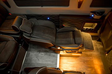 Comfortable interior of a passenger bus with soft seats