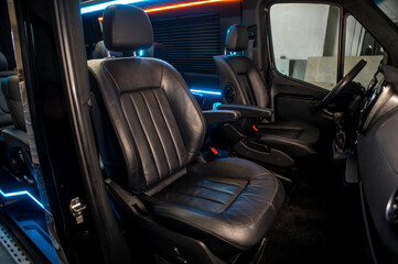 Comfortable interior of a passenger bus with soft seats
