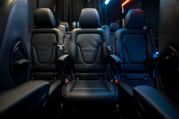 Comfortable interior of a passenger bus with soft seats