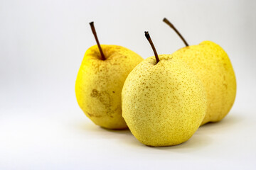 Three asian nashi pears set isolated on white background with selective focus.
