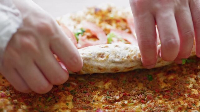 Traditional Turkish dish lahmacun in close-up	