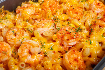 pasta with shrimp and cheese, with a golden crust, cooked in a baking dish, homemade, no people,