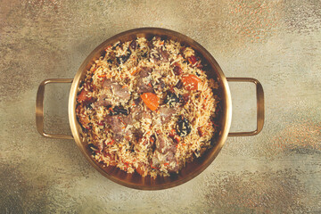 rice dish with meat and dried fruits, in a large pot, pilaf, homemade, no people