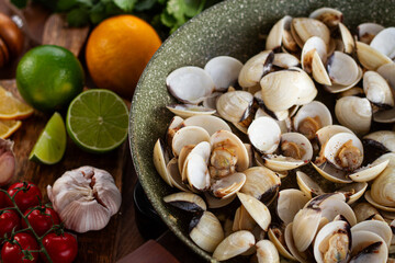 cooking, vongole clams, in a pan with spices and white wine, top view, no people,