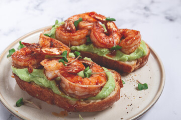 sandwiches with avocado and caramelized shrimp, micro-greens, breakfast, on a plate, top view, homemade, no people,